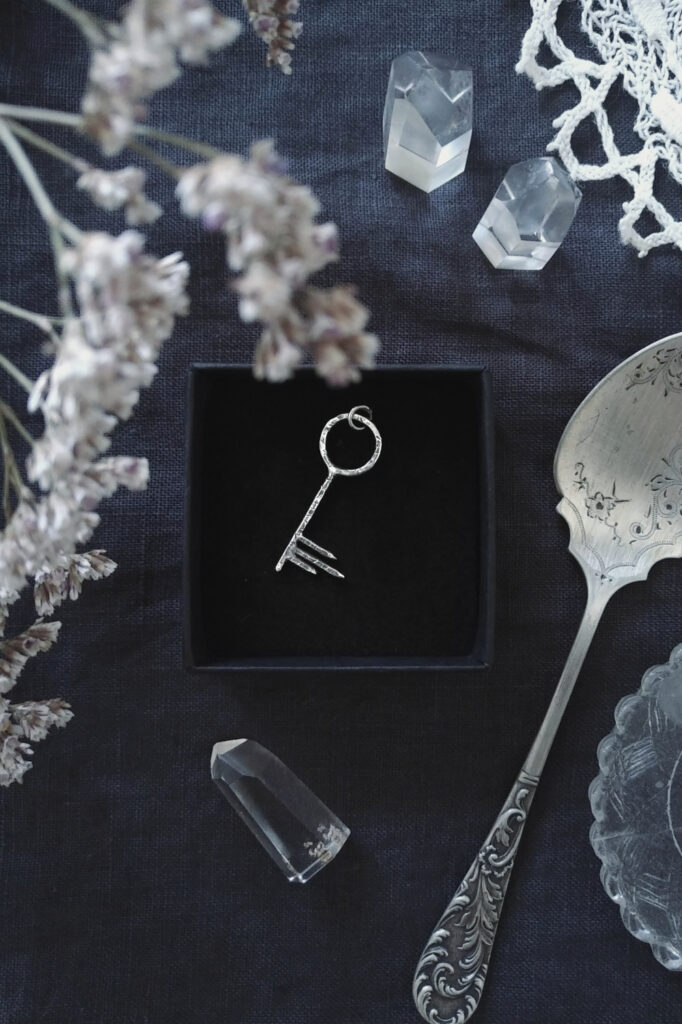 distressed silver key pendant with an antique spoon