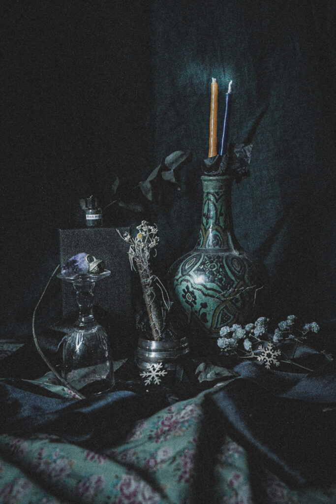 custom magick kit still life with candles and green vase
