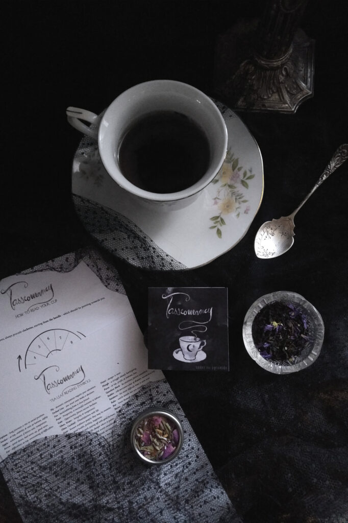 tasseography kit with vintage teacup, antique spoon, loose tea, incense