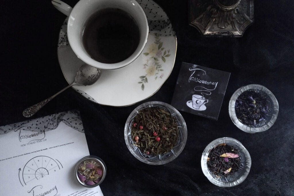 vintage teacup and a selection of loose teas for tasseomancy